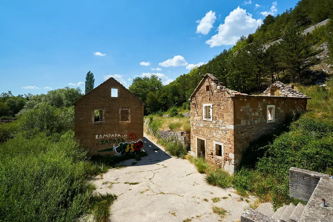 The Krčić stream dropping off the karst edge into the Krka's source canyon near Knin