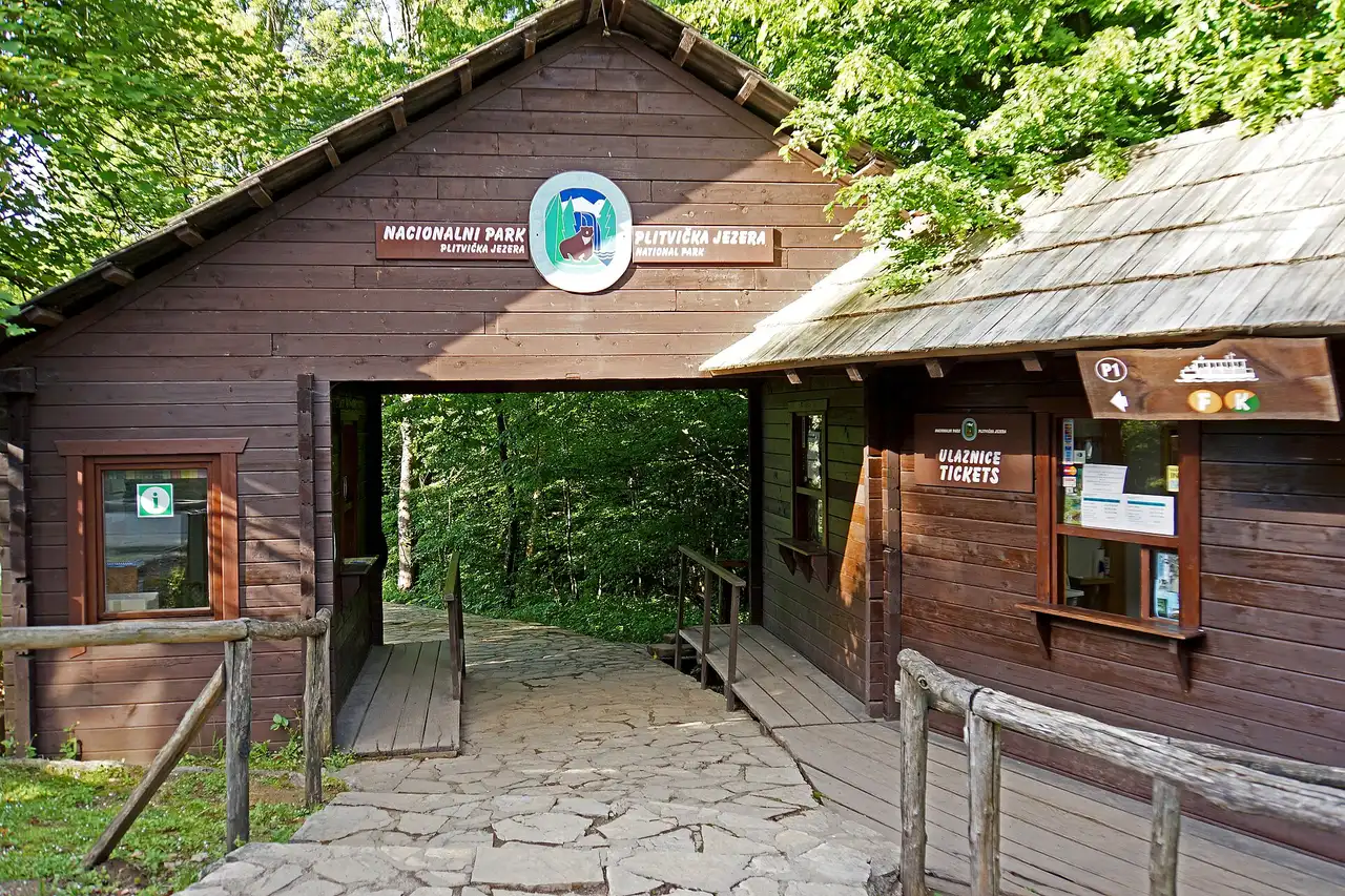 The wooden boardwalks above the turquoise lakes that the dated plitvice tickets system admits visitors to