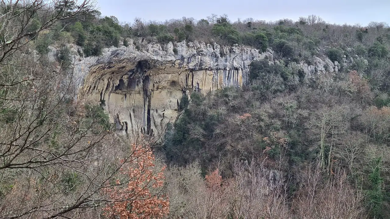 The Sopot waterfall dropping over a limestone lip into a green pool in the hills above Buzet