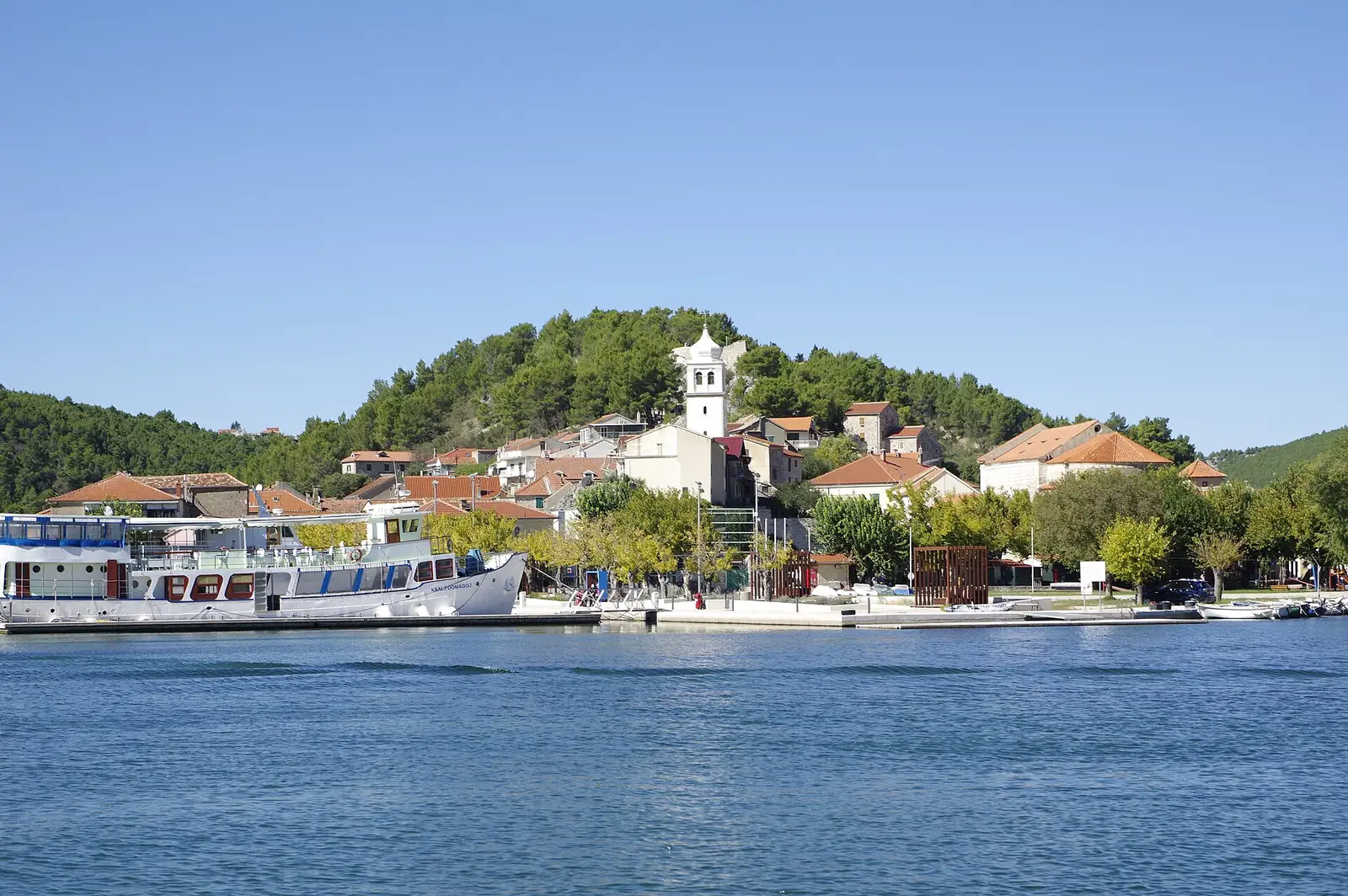 A river village base with mills and tufa shelves — the kind of settlement that answers where to stay for croatia waterfalls